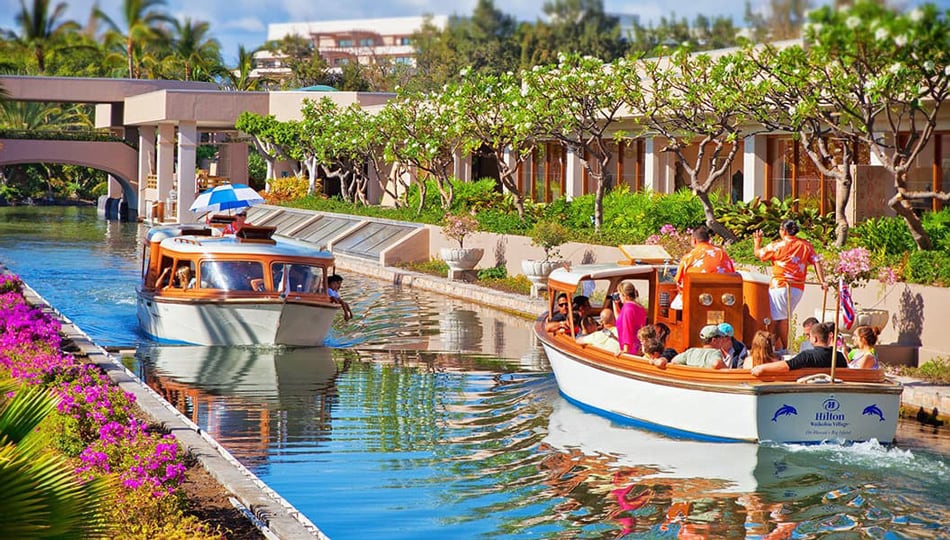 Canal Boats Ferry Guests Around the Hilton Waikoloa Village Resort