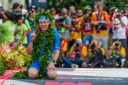 2018 Ironman World Champion Patrick Lange gives a shaka at the finish line.