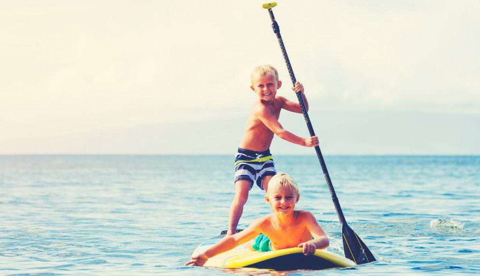 Kids Paddle boarding in Hawaii