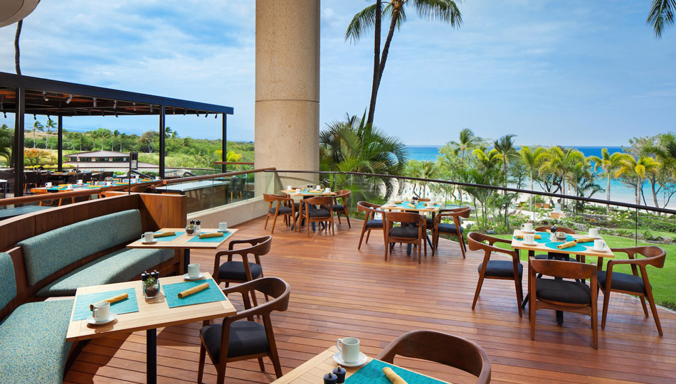 Ikena Landing Restaurant seating with ocean views at the Hapuna Beach Resort