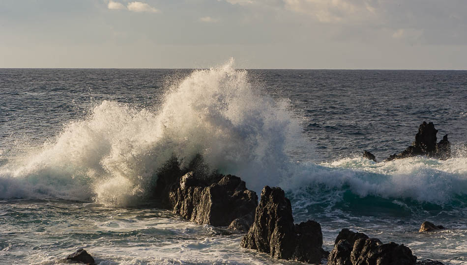Waves crashing on lava rock at Laupahoehoe Point Beach Park
